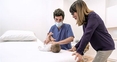 Specialist Examining Baby