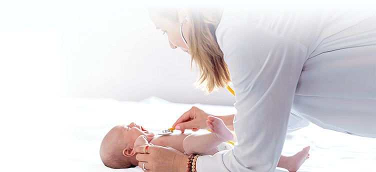 Young Doctor Examining Baby